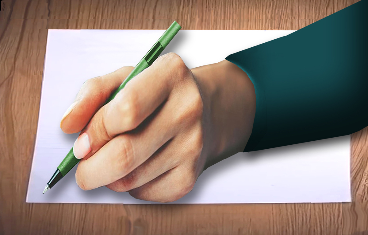 Hand holding a pen
